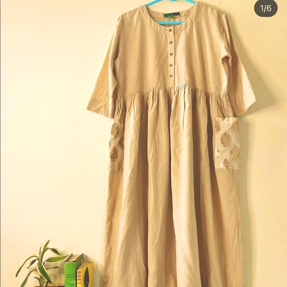 Ivory coloured cotton dress.